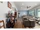 Open floor plan with living room and dining area featuring hardwood floors and a comfortable leather couch at 4044 E Dawson E Dr, Chandler, AZ 85249