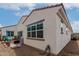 A patio area with a grill, seating, and a decorative tile roof above at 4044 E Dawson E Dr, Chandler, AZ 85249