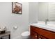 Modern powder room featuring stylish fixtures, a vanity with storage, and tasteful decor at 4044 E Dawson E Dr, Chandler, AZ 85249