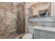 Bathroom with marble tile shower and white sink with vanity at 4144 N 29Th Ave, Phoenix, AZ 85017