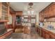 Galley kitchen showcasing wood cabinets, retro appliances, and tile flooring, exuding a vintage charm at 4144 N 29Th Ave, Phoenix, AZ 85017