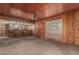 Living room with wood walls, ceiling fan, and access to a bar area at 4144 N 29Th Ave, Phoenix, AZ 85017