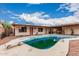 Backyard pool with diving board and surrounding patio at 4144 N 29Th Ave, Phoenix, AZ 85017