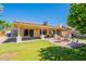 Spacious backyard with covered patio, paver extension, and a cozy fire pit, ideal for outdoor gatherings at 4349 W Cielo Grande --, Glendale, AZ 85310
