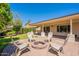 Paver patio with inviting seating around a fire pit, perfect for outdoor entertaining and relaxation at 4349 W Cielo Grande --, Glendale, AZ 85310