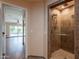 Modern bathroom with a tiled walk-in shower featuring a rainfall shower head and grab bar for safety at 4349 W Cielo Grande --, Glendale, AZ 85310