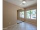 Bright bedroom with mirrored closet doors and a large window offering outdoor views at 4349 W Cielo Grande --, Glendale, AZ 85310