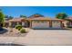Charming single-story home featuring a three-car garage, landscaped yard and neutral color palette at 4349 W Cielo Grande --, Glendale, AZ 85310