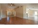 Bright open-concept living room with laminate flooring, ceiling fan and seamless flow to kitchen at 4349 W Cielo Grande --, Glendale, AZ 85310