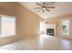 Bright living room with tile flooring, a fireplace and plenty of natural light at 4349 W Cielo Grande --, Glendale, AZ 85310