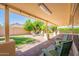 Covered patio with string lights, a fire pit, and outdoor seating offering a relaxing outdoor space at 4349 W Cielo Grande --, Glendale, AZ 85310