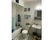 Bathroom featuring a blue and white patterned floor, toilet, tub and sink at 4410 N 50Th Dr, Phoenix, AZ 85031
