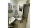 Simple bathroom with vintage fixtures, including a sink and toilet at 4410 N 50Th Dr, Phoenix, AZ 85031