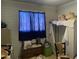 Bedroom with a window, storage cabinet, storage chest, and a chair at 4410 N 50Th Dr, Phoenix, AZ 85031