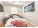 Cozy bedroom features a comfortable bed, stylish art, and a window with bright natural light at 4419 N 24Th Way, Phoenix, AZ 85016