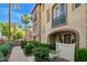 Townhouse with stone accents, arched entryway, and wrought-iron balcony at 4419 N 24Th Way, Phoenix, AZ 85016