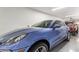 Spacious garage featuring a blue SUV and red truck, offering ample parking and storage at 4419 N 24Th Way, Phoenix, AZ 85016