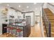 Modern kitchen featuring white cabinets, black countertops, a large island, and stainless steel appliances at 4419 N 24Th Way, Phoenix, AZ 85016