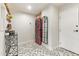 Laundry room with stacked washer/dryer unit, geometric tiled floor, and decor for efficient functionality at 4419 N 24Th Way, Phoenix, AZ 85016