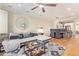 Open-concept living area with a plush sofa, stylish decor, a view into dining area, and hardwood floors at 4419 N 24Th Way, Phoenix, AZ 85016