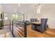 Open concept living and dining area with modern lighting, wood floors, and large windows at 4419 N 24Th Way, Phoenix, AZ 85016