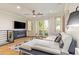 Spacious living room featuring a modern fireplace, comfortable seating, French doors, and contemporary decor at 4419 N 24Th Way, Phoenix, AZ 85016