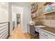 Hallway with built-in office, wood floors, crown molding and bright natural light creates a welcoming workspace at 4419 N 24Th Way, Phoenix, AZ 85016