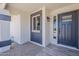 View of the beautiful front door and desert-style landscaping of this home at 4509 E La Puente Ave, Phoenix, AZ 85044