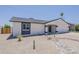 This single-story home features a charming entrance and low-maintenance desert landscaping at 4509 E La Puente Ave, Phoenix, AZ 85044