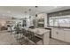 Open-concept kitchen with stainless steel appliances, a quartz countertop island, and a modern design at 4509 E La Puente Ave, Phoenix, AZ 85044
