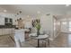 Modern kitchen with stainless steel appliances and dining area with seating for four at 4509 E La Puente Ave, Phoenix, AZ 85044