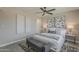 Serene main bedroom with a ceiling fan, stylish decor, and neutral colors at 4509 E La Puente Ave, Phoenix, AZ 85044