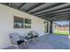 Charming outdoor patio features comfortable seating and views of the manicured backyard at 4509 E La Puente Ave, Phoenix, AZ 85044