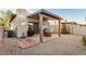 Patio and landscaped backyard, with a covered seating area and desert plants at 5445 E Mckellips Rd # 23, Mesa, AZ 85215