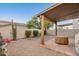 Outdoor patio area with desert landscaping, rock features, and a covered seating area at 5445 E Mckellips Rd # 23, Mesa, AZ 85215