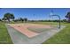 Outdoor basketball court featuring well-maintained surfaces and a clear sky backdrop at 5445 E Mckellips Rd # 23, Mesa, AZ 85215