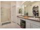 Bright bathroom featuring double sinks, granite countertops, and a walk-in shower at 5445 E Mckellips Rd # 23, Mesa, AZ 85215