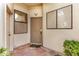 Charming entryway featuring a security screen door, terracotta tile, and inviting decor at 5445 E Mckellips Rd # 23, Mesa, AZ 85215