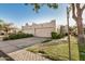 Southwestern home featuring attached garages, desert landscaping, neutral paint, and bronco artistic desert detail at 5445 E Mckellips Rd # 23, Mesa, AZ 85215