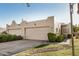 Southwestern home featuring an attached garage, desert landscaping, neutral paint, and an artistic desert bronco detail at 5445 E Mckellips Rd # 23, Mesa, AZ 85215