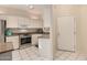 This kitchen features white cabinets, stainless steel appliances, and granite countertops at 5445 E Mckellips Rd # 23, Mesa, AZ 85215