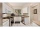 Bright kitchen features white cabinets, stainless steel appliances, and granite countertops at 5445 E Mckellips Rd # 23, Mesa, AZ 85215