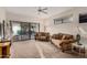 Inviting living room with plush carpet, dual couches, natural light, and a ceiling fan at 5445 E Mckellips Rd # 23, Mesa, AZ 85215