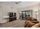 Comfortable living room with plush carpeting, sliding glass doors, and a ceiling fan at 5445 E Mckellips Rd # 23, Mesa, AZ 85215