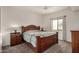 This bedroom features a large bed, ceiling fan, and a window that provides natural light at 5445 E Mckellips Rd # 23, Mesa, AZ 85215