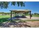 Shaded picnic area with multiple tables and views of the surrounding park at 5445 E Mckellips Rd # 23, Mesa, AZ 85215