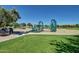 Community playground with climbing structures, slides, and safe play areas at 5445 E Mckellips Rd # 23, Mesa, AZ 85215