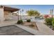 Fenced community pool area with desert landscaping and covered patio at 5445 E Mckellips Rd # 23, Mesa, AZ 85215