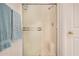 Close-up of the shower with a built-in seat and sliding glass doors at 5445 E Mckellips Rd # 23, Mesa, AZ 85215