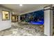 Relaxing covered patio with lounge chairs, landscaping, and pool views, ideal for leisure at 6112 E Jenan Dr, Scottsdale, AZ 85254